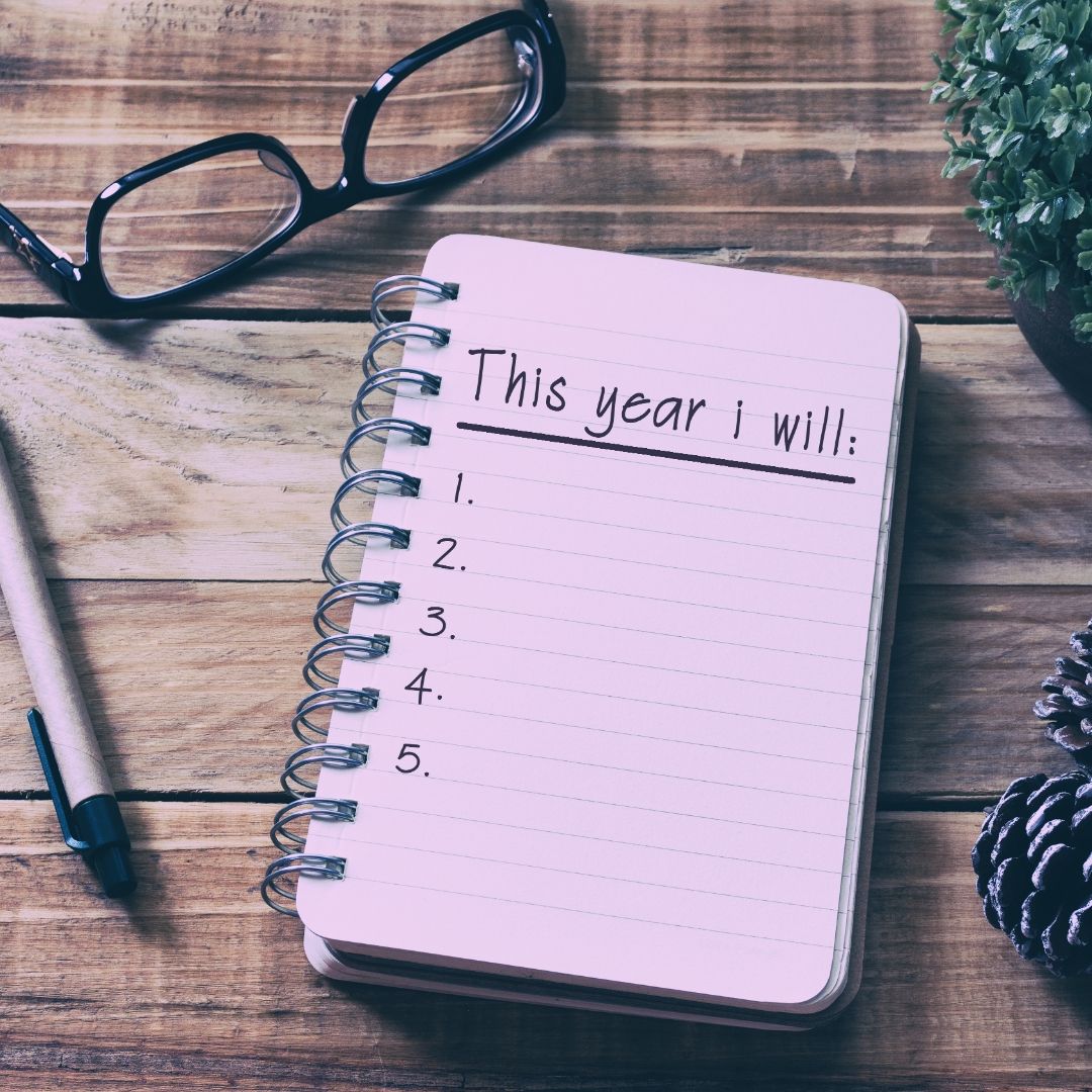 New Year's resolutions for your business. A desk with a blank notepad lying on it.